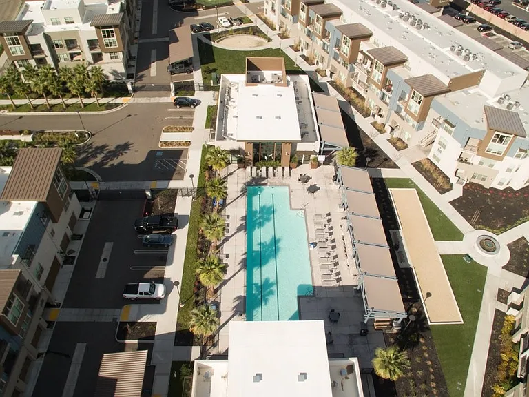 An aerial view of Aspire Apartments in Tracy California, Luxury living with a swimming pool.