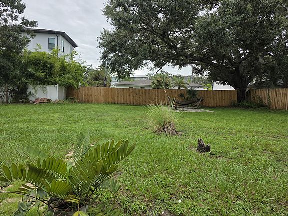 Back yard all fenced plenty of shade over paved barbecue area.