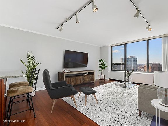 Living Room with Views of Downtown Skyline and Wrigley Field