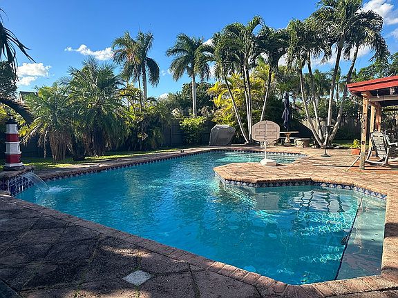 Backyard pool with waterfall