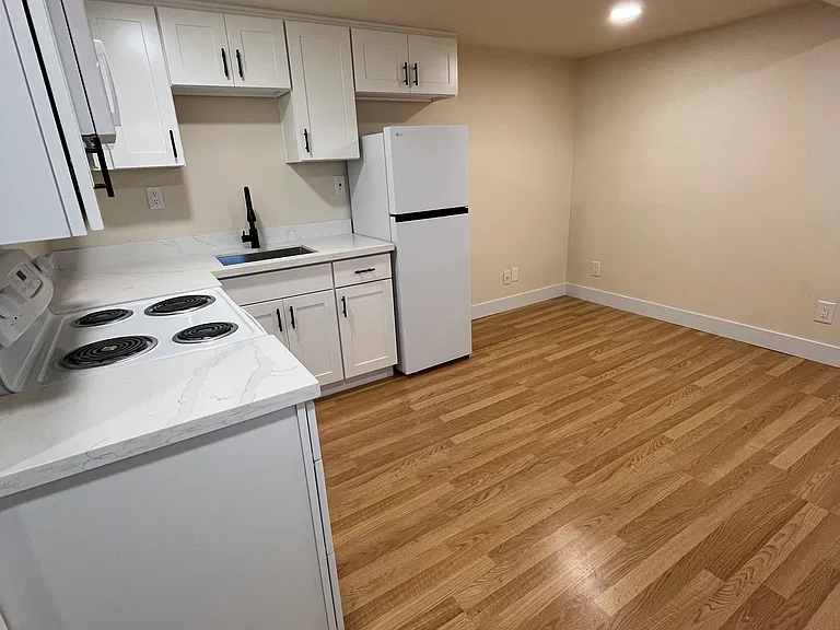 Great room and kitchen fully updated with modern cabinetry.