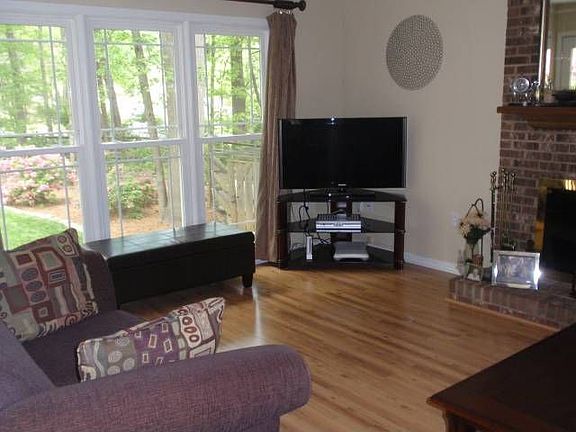 Den with view of backyard