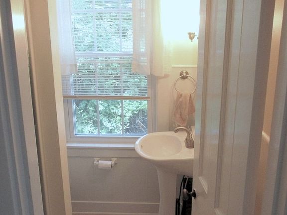 Downstairs bath, to left (not visible) is door leading to basement.