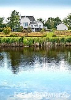 Convenient side load three-car garage, and a walkout basement.