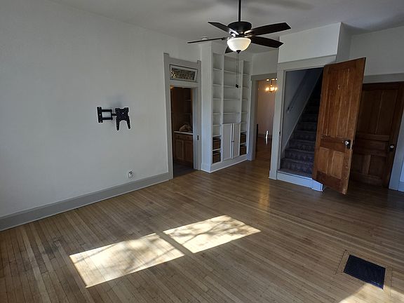 This can be used as a living or a dining area, built in bookshelves
