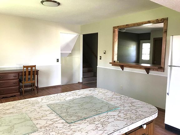 Dining Room with seating area and passthrough/bar.