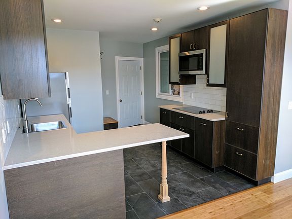 Quartz Counter-tops and lots of cabinet storage