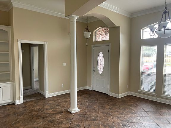 Front entry, views to dining room & remote bedrooms