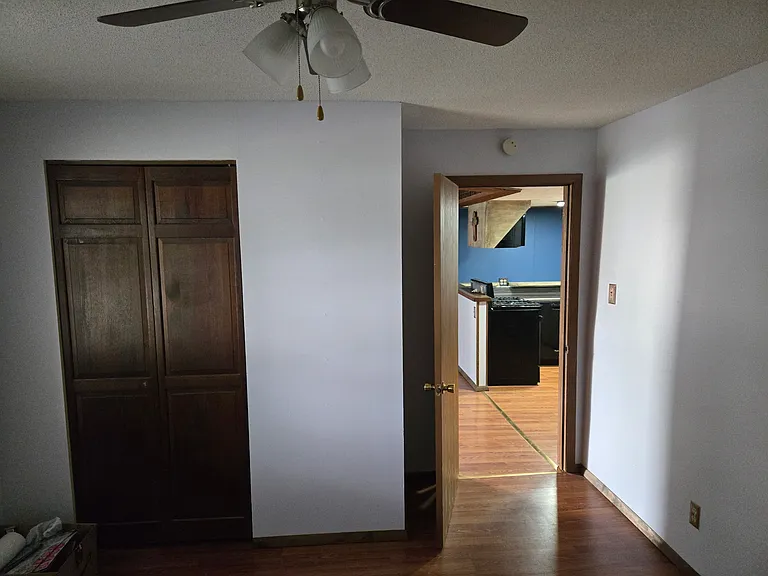 Bedroom 2 has small closet and is centrally located off the kitchen and adjacent to Bedroom 1. Could be used for a small child's bedroom, home office, or dining room.