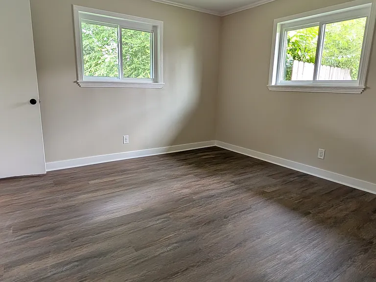 Primary bedroom with attached bathroom