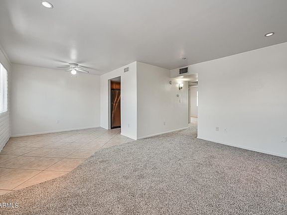 Living room carpeted.
Dinning room tiled.