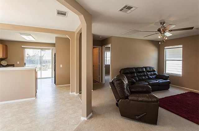The downstairs flows well with the living room, dining area, and kitchen all open to one another, ye