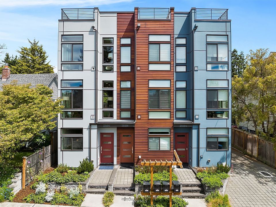 Front corner row house (the light grey one on the left)