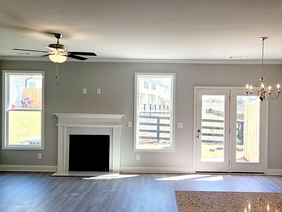 Cozy gas fireplace in bright and airy living room
