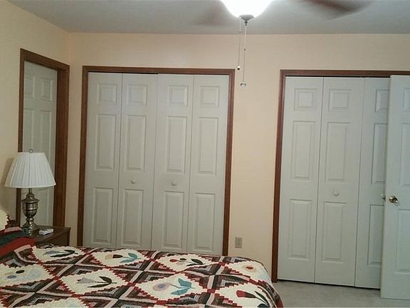 Second floor bedroom with ample closets. Door to the left of the picture is to unfinsihed bonus room.
