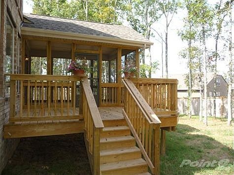 BEAUTIFUL COVERED AND SCREENED-IN DECK PLUS THE ADDTIONAL EXTENDED OPEN DECK WITH STEPS INTO THE BAC