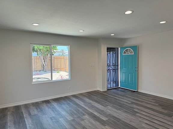 Living room opens to fenced yard.