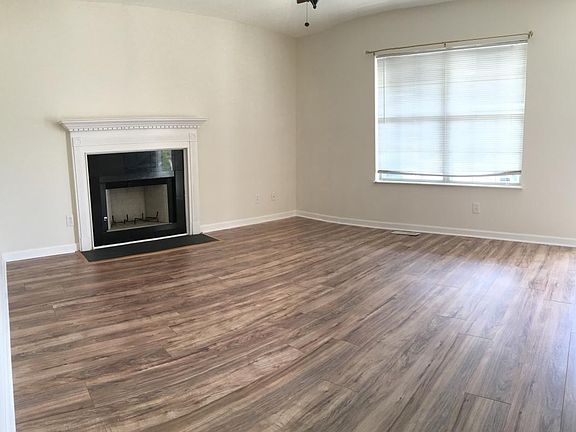 Living Room w/Fireplace (new floors)