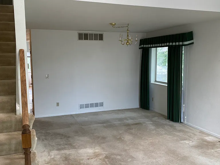Dining area in front room looking up at loft