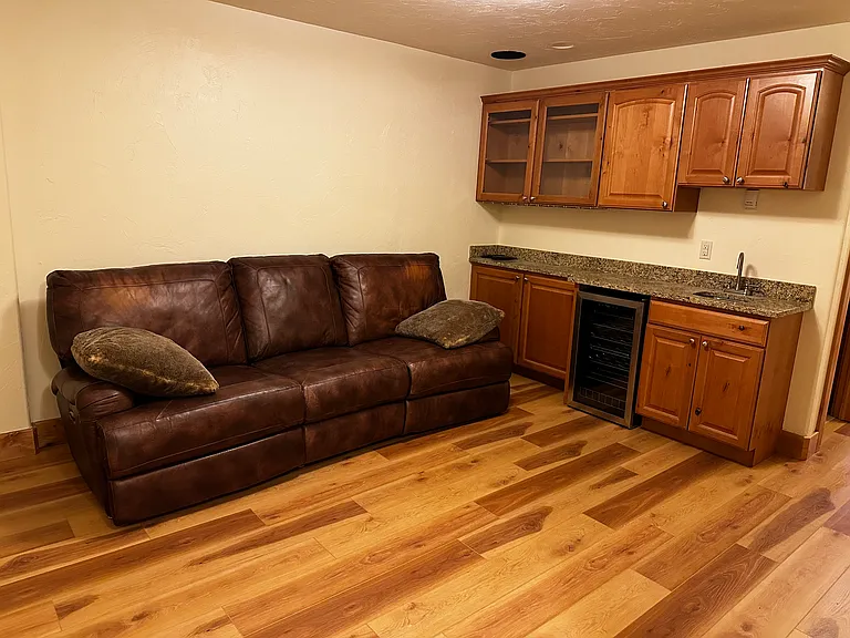 downstairs living room with couch and tv