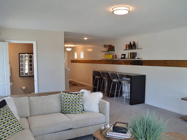 An extra powder room on this ground level floor gives an added convenience to staging this room however you'd like. There is plenty of wall space for an office area with desk or bookcases.
