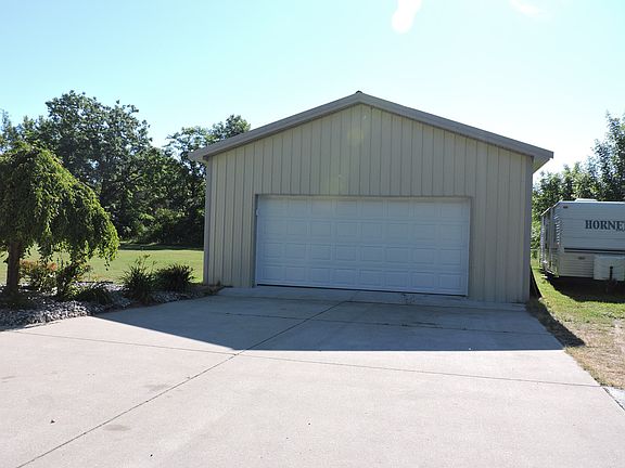 24 x 40 Outbuilding has electric, cement floors and drywall hung.  