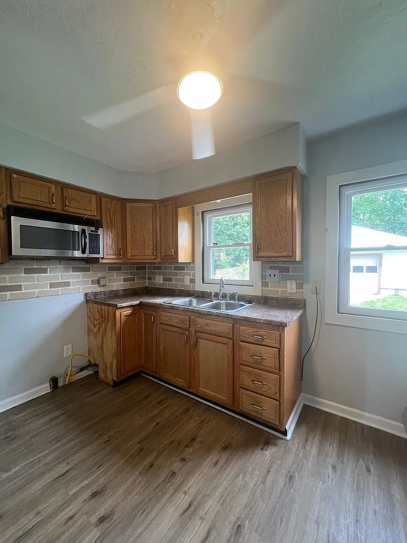 955 E 223rd St | Spacious 3-Bedroom, 1.5-Bath Home with Garage — Photo 4
