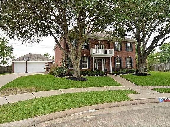 Oversized 14,221 square foot lot with stately Live Oaks and Professional Landscaping.