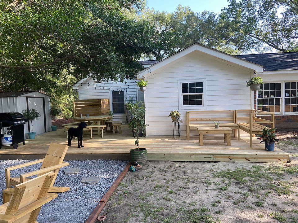 Backyard with firepit and Tv's