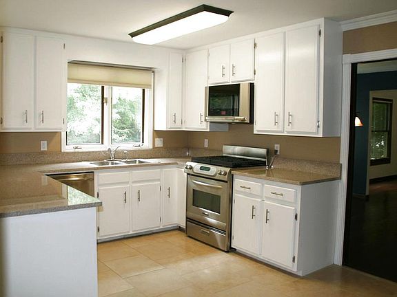 This wonderful nice large kitchen that has new granite counter tops is very inviting.  With nice tile flooring