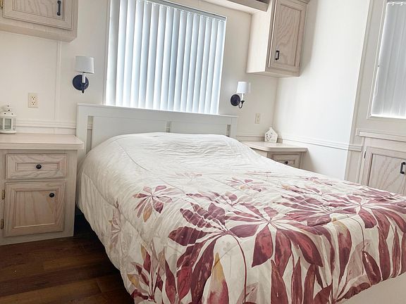 Bedroom comes furnished with comfy Queen bed and lots of built in drawers.