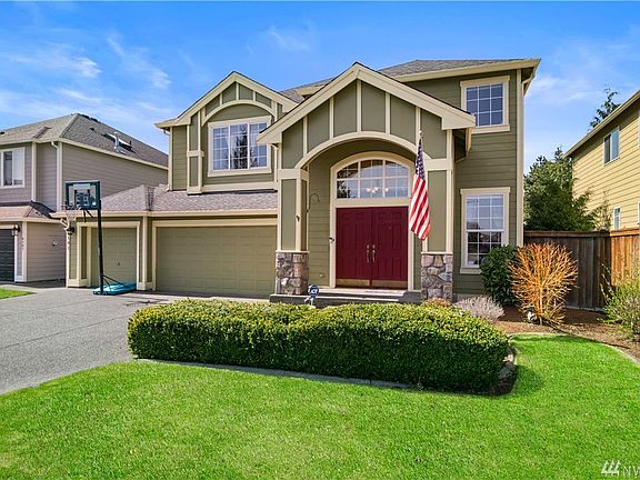 Immaculate landscaping and a charming exterior meet you. 