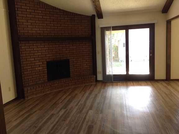 Vaulted living w/ FP