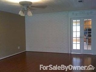 living room : French doors lead into kitchen/dining area. They block sound from kitchen area.