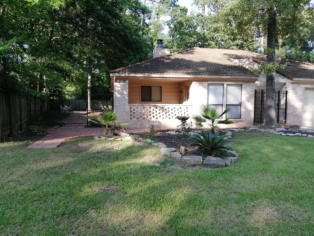Wood decked front porch beside the kitchen dining area - 12018 Meadowview Dr