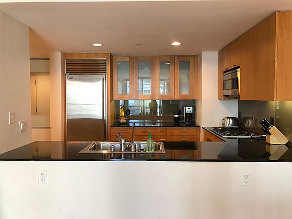 Stainless Steel Kitchen with Granite Countertops and Top of the Line Appliances - Sub-Zero refrigerator.