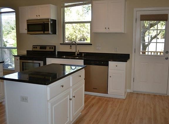 Light and bright kitchen with granite counters