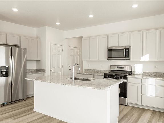 The Cottonwood floorplan interior image taken at a Meritage Homes community in Windsor, CO.