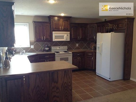 Nice tiled kitchen with plenty of cabinets