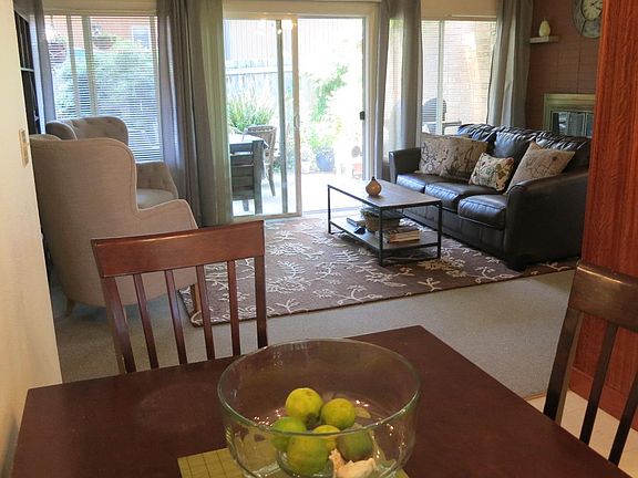Dining area looking through living area to patio (NOTE:  fur