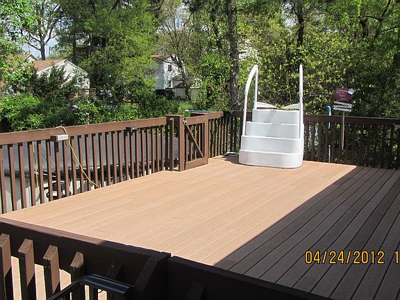 DECK W/ ACCESS TO ABOVE GROUND POOL