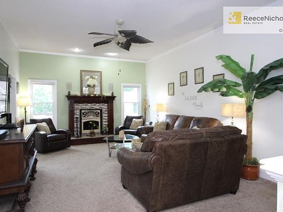 Wonderful Fireplace updated flanked by the huge windows for natural light!