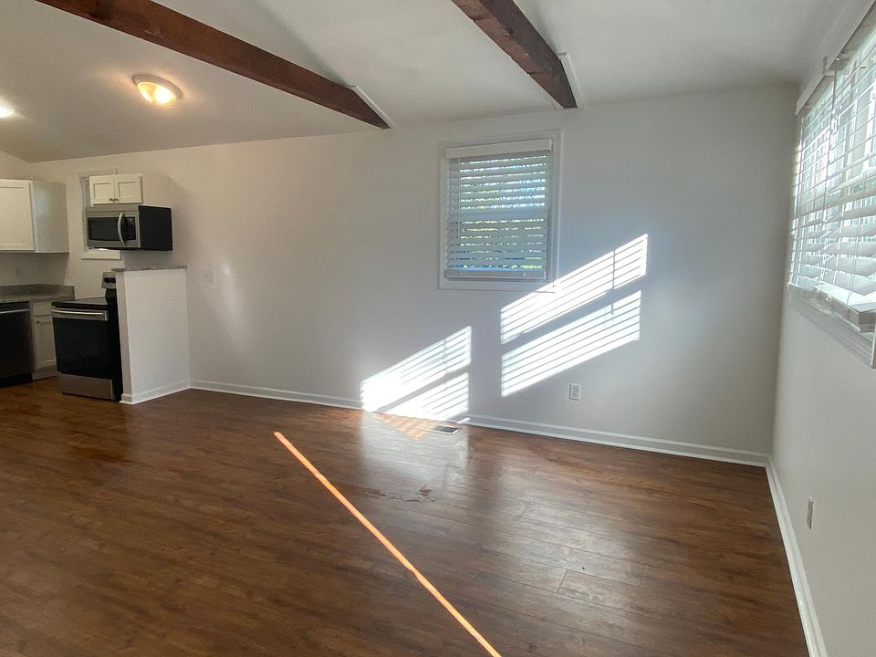 Living area with vaulted ceiling.