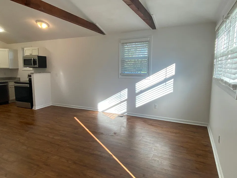Living area with vaulted ceiling.