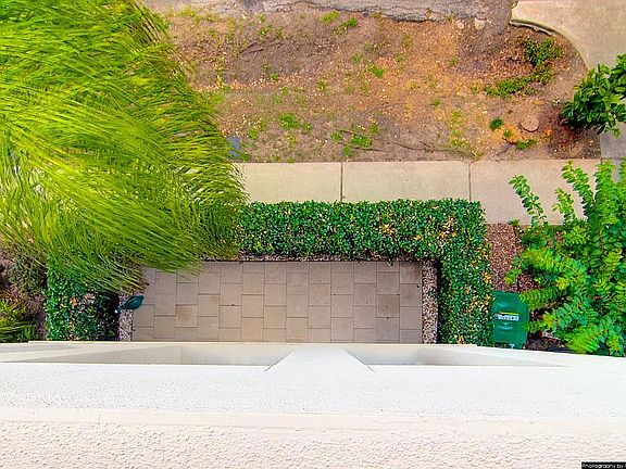 Spacious fenced front yard.