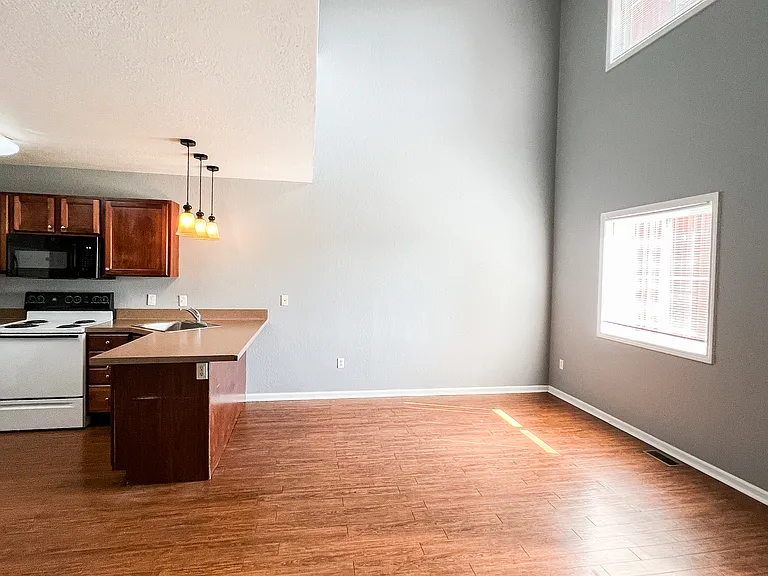 Kitchen and living room with new paint color.