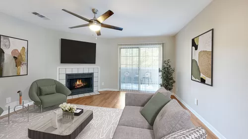 Newly Renovated Living Room with Cozy Fireplace - The Landings of Brentwood Apartments
