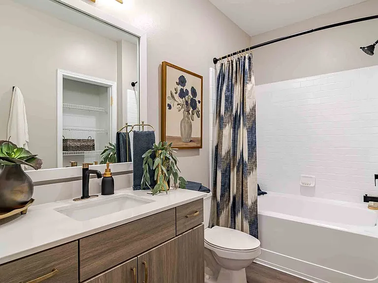 Newly renovated bathroom with quartz countertops and new fixtures