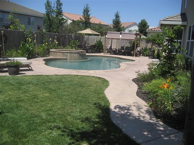 Spacious backyard with salt water, pebble tec pool w/ waterfall