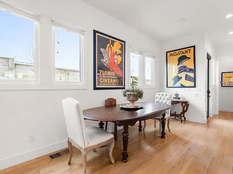 Open living area filled with natural light and seamless flow to kitchen and dining spaces.